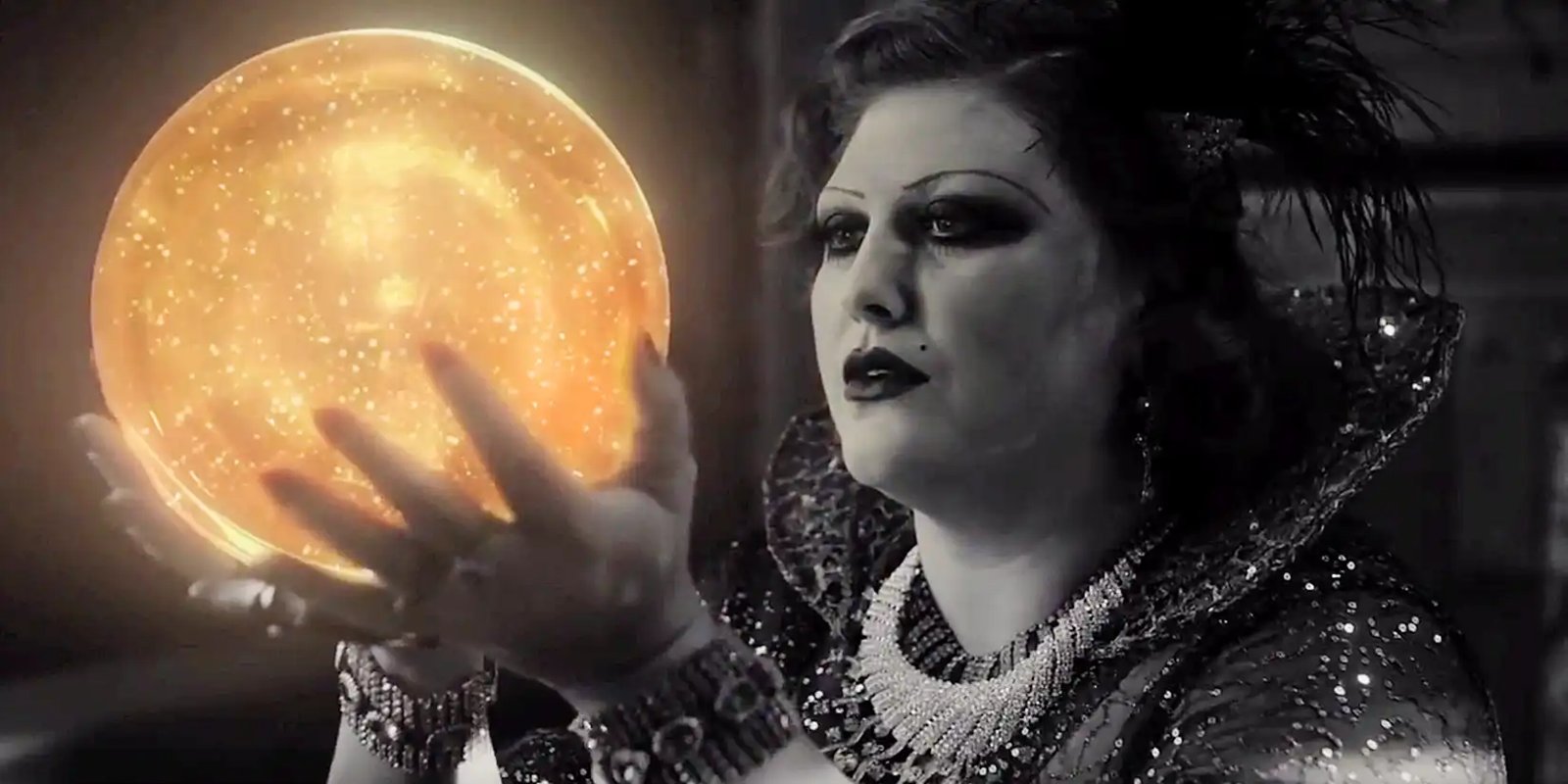Lady Dido, in black and white, holds a glowing golden orb with Laura Palmer's picture in it from Twin Peaks the Return